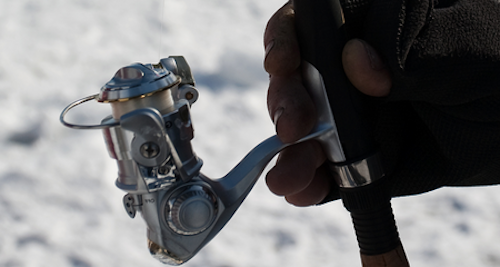 Photo of ice fishing reel spooled with monofilament line