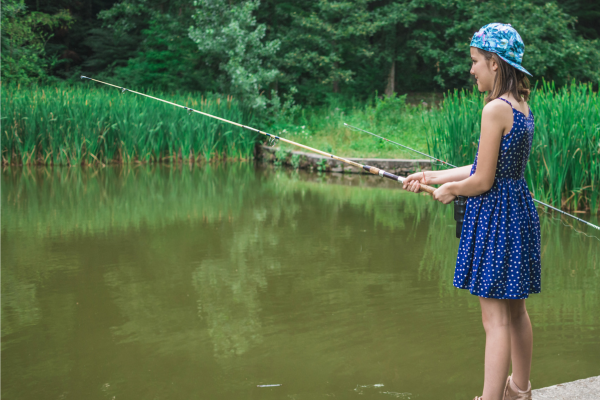 Teenager fishing at a pond
