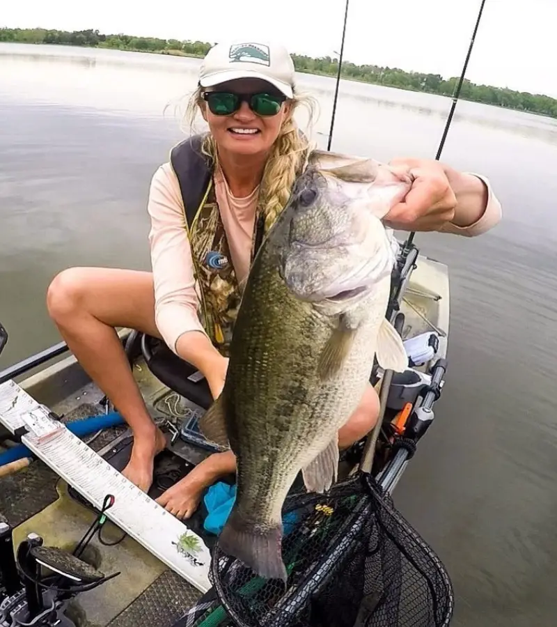 Photo of an angler holding a big largemouth bass caught with a drop shot rig